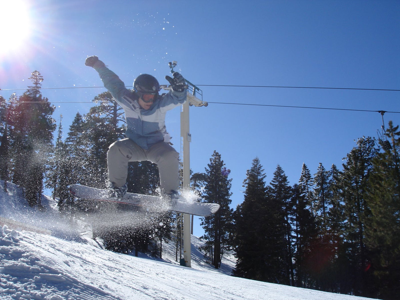 Melissa Allen, co-creator of Active Life Company and Kovr Sunscreen, catching some air while snowboarding.